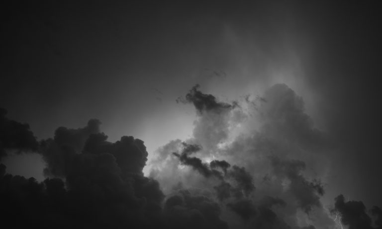 dark black clouds in the background depicting the cost of avoiding fear